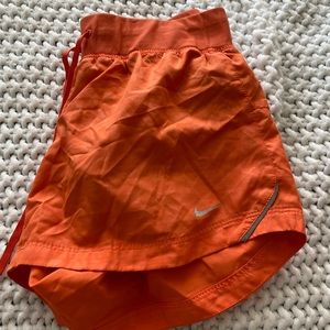 Orange nike shorts